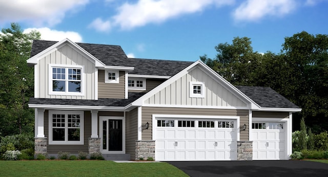 craftsman inspired home featuring a front lawn and a garage