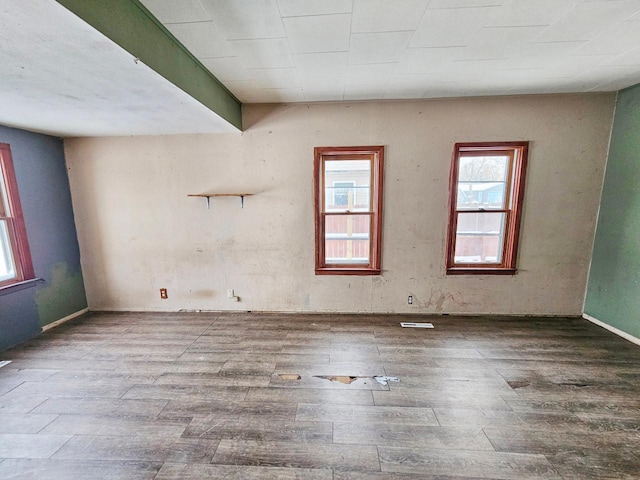 spare room featuring hardwood / wood-style floors