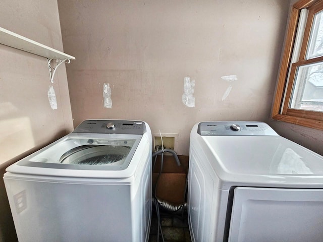 laundry room featuring separate washer and dryer