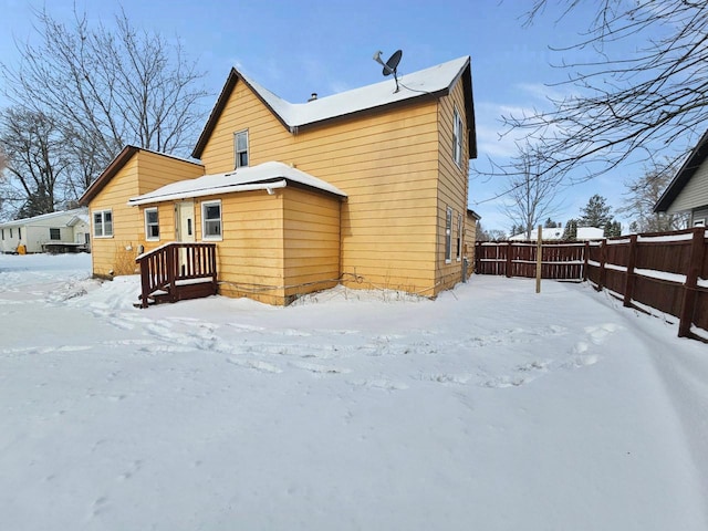 view of snow covered house