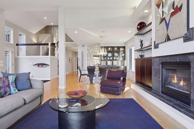 3529 Green Ridge Rd, Minnetonka, MN 55305 - living room featuring wood finished floors, a tiled fireplace, recessed lighting, and baseboards