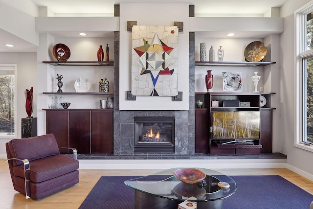 3529 Green Ridge Rd, Minnetonka, MN 55305 - living area with wood finished floors, a tile fireplace, plenty of natural light, and recessed lighting