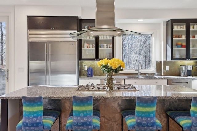 3529 Green Ridge Rd, Minnetonka, MN 55305 - kitchen featuring stainless steel appliances, a sink, glass insert cabinets, a breakfast bar area, and recessed lighting