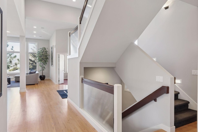 3529 Green Ridge Rd, Minnetonka, MN 55305 - staircase featuring wood finished floors, baseboards, and recessed lighting