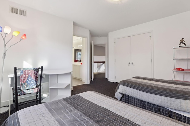 3529 Green Ridge Rd, Minnetonka, MN 55305 - bedroom with dark colored carpet, baseboards, and a closet