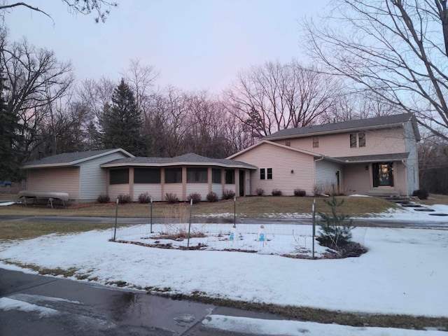 view of front of property featuring a sunroom