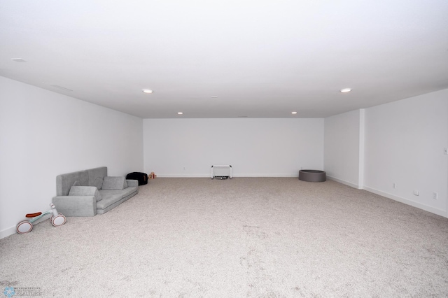 basement featuring light colored carpet