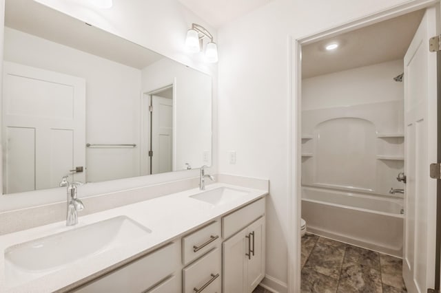 full bathroom featuring shower / tub combination, vanity, and toilet