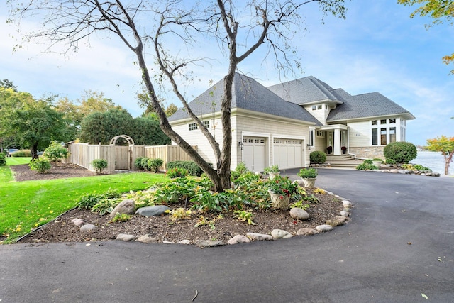 view of front of home with a garage and a front yard