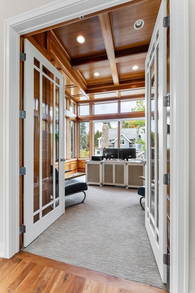 sunroom featuring coffered ceiling, wood ceiling, and french doors