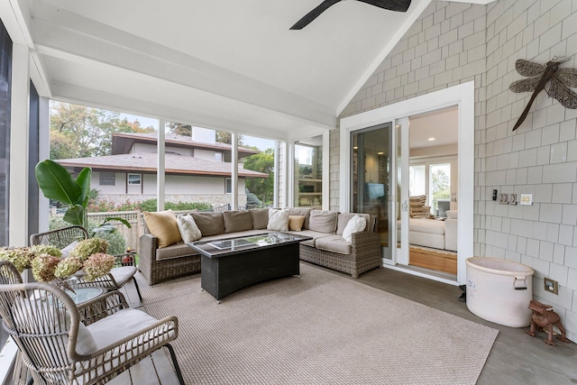 sunroom / solarium with lofted ceiling and ceiling fan