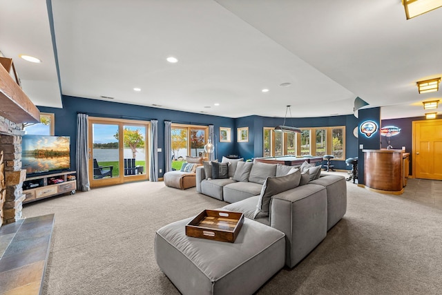 carpeted living room featuring a wealth of natural light and billiards