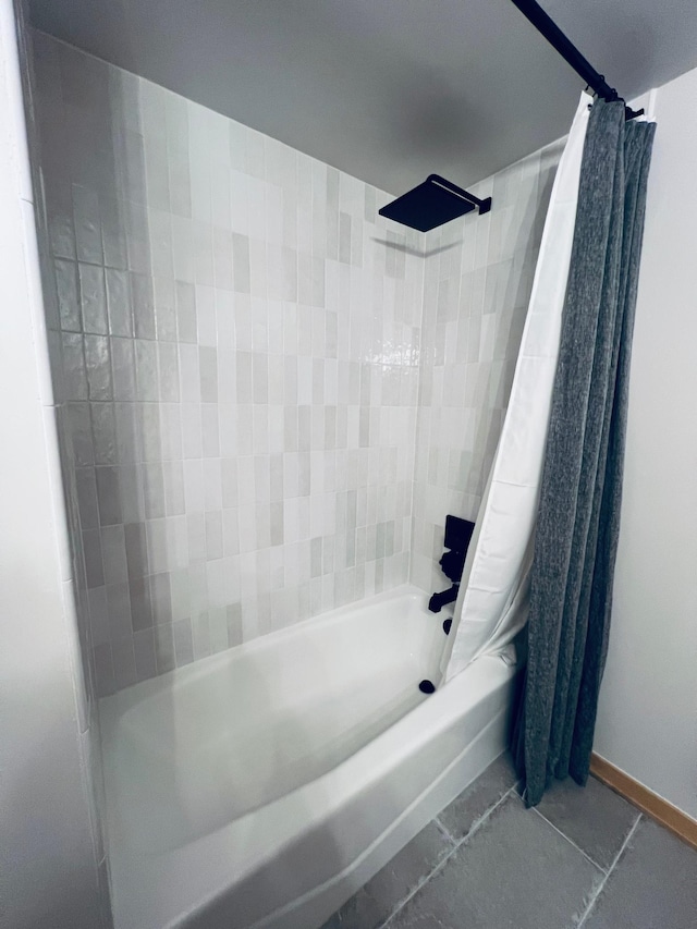 bathroom featuring tile patterned flooring and shower / bath combo