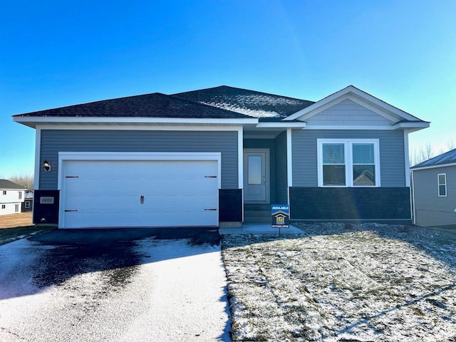 view of front of property with a garage