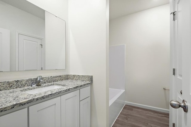 bathroom featuring vanity,  shower combination, and hardwood / wood-style flooring