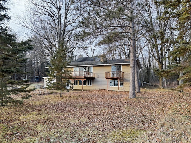 rear view of property with a deck