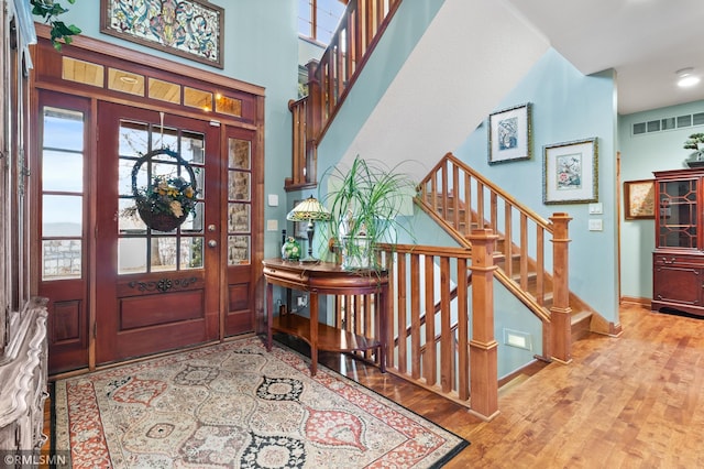 foyer entrance with light wood-type flooring