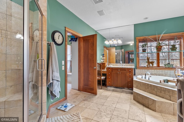 bathroom with separate shower and tub and vanity