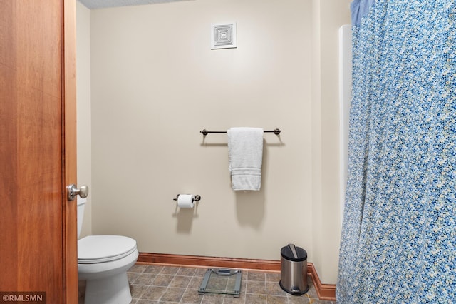 bathroom featuring toilet