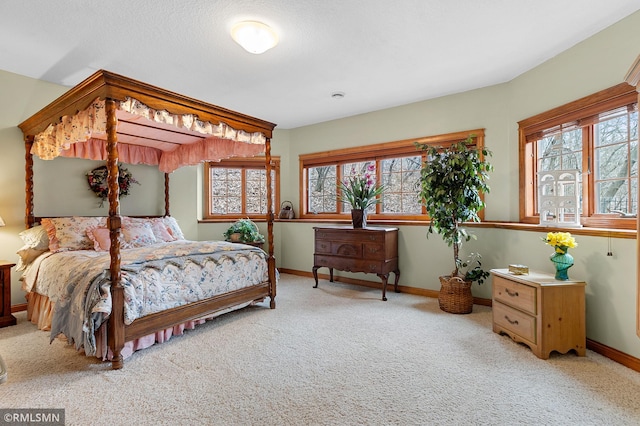 bedroom featuring light carpet