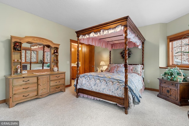 bedroom featuring light carpet