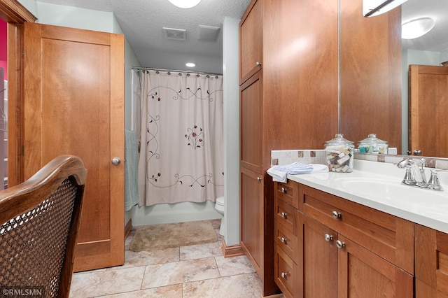 full bathroom featuring toilet, shower / bath combo, vanity, and a textured ceiling