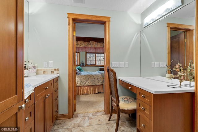 bathroom with vanity and tile patterned floors