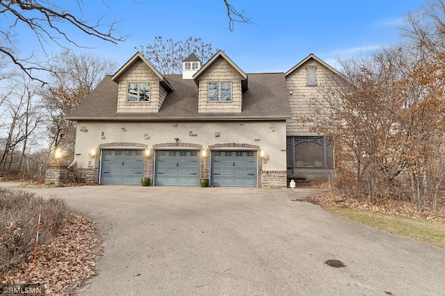 view of front of home with a garage