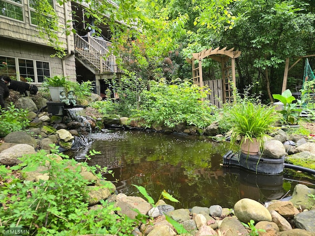 view of yard with a small pond