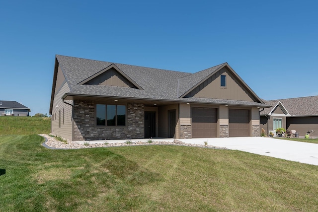 1018 Mahoe Way, Mankato, MN 56001 - view of front of property with stone siding, driveway, an attached garage, and board and batten siding