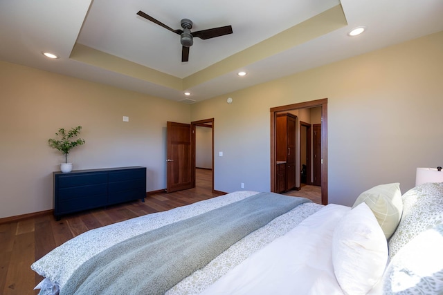 1018 Mahoe Way, Mankato, MN 56001 - bedroom featuring recessed lighting, wood finished floors, a raised ceiling, and ensuite bath