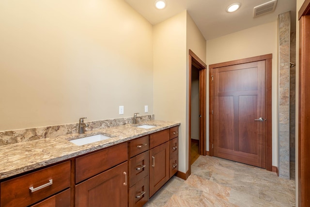 1018 Mahoe Way, Mankato, MN 56001 - bathroom with double vanity and baseboards