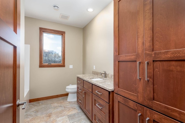 1018 Mahoe Way, Mankato, MN 56001 - bathroom with stone finish floors, a tub to relax in, vanity, and recessed lighting