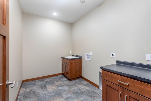 1018 Mahoe Way, Mankato, MN 56001 - washroom featuring electric dryer hookup, washer hookup, stone finish floors, cabinet space, and recessed lighting