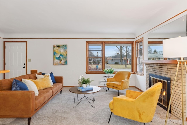 living room with a fireplace and light carpet