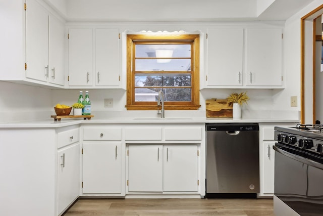 kitchen with black stove, sink, white cabinets, and stainless steel dishwasher