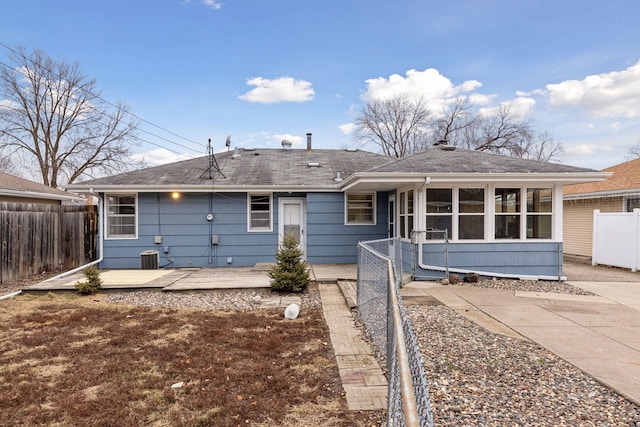 back of house featuring a deck and a sunroom