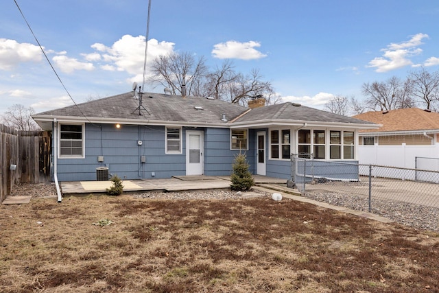 back of property featuring central AC