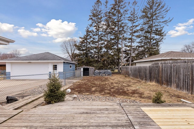 deck with a garage and an outdoor structure