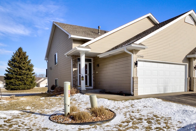 front facade with a garage