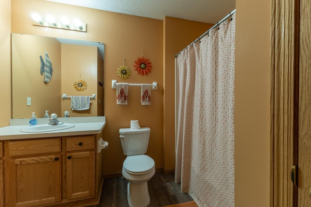 bathroom with vanity, wood-type flooring, and toilet