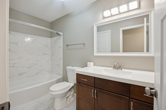 full bathroom with tiled shower / bath combo, vanity, a textured ceiling, and toilet