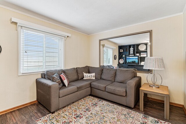 living room featuring wood-type flooring and crown molding