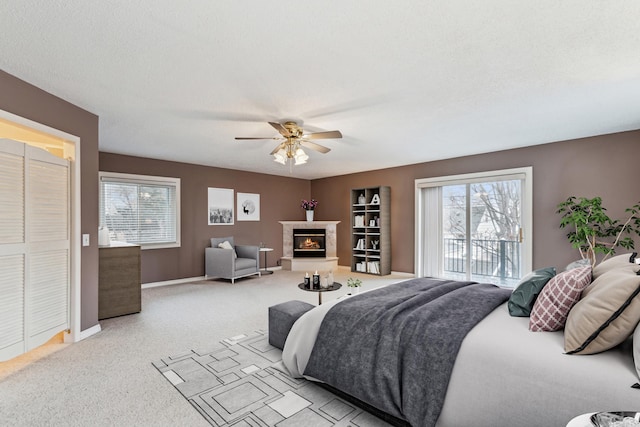 bedroom featuring ceiling fan, access to exterior, and light carpet