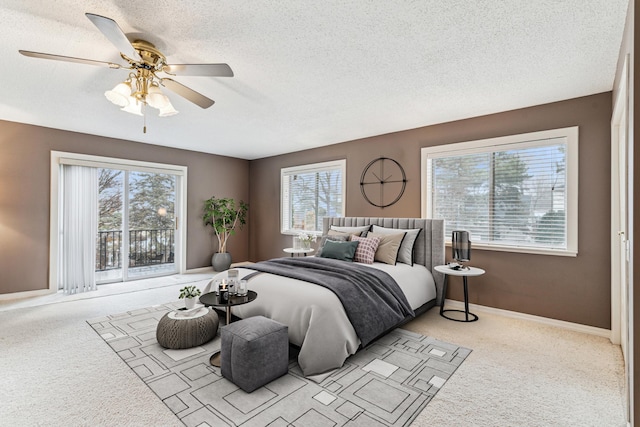 bedroom with multiple windows, light carpet, and ceiling fan