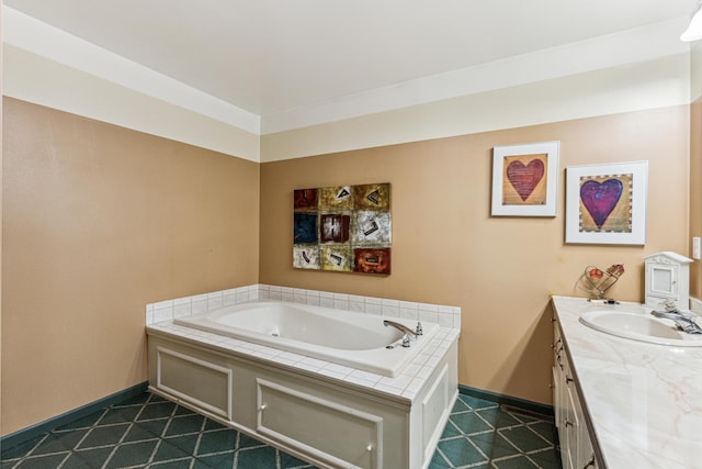 bathroom featuring tile patterned flooring, vanity, and a tub