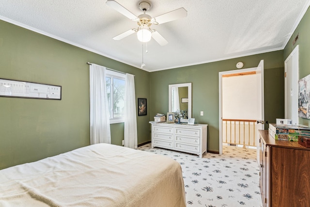 bedroom featuring ceiling fan, ornamental molding, and a textured ceiling