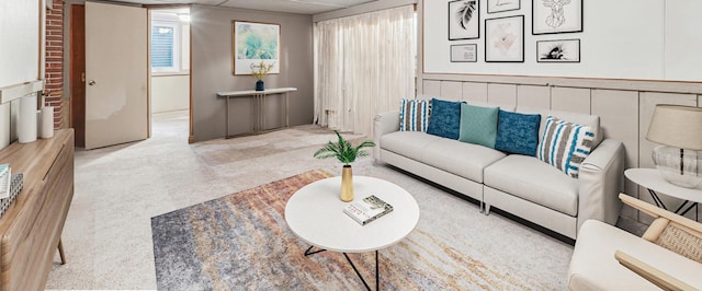 living room featuring a drop ceiling