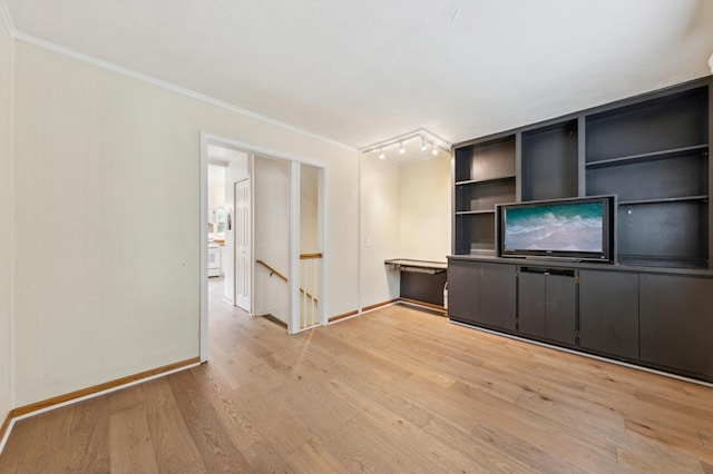 5945 Kellogg Ave, Edina, MN 55424 - unfurnished living room with crown molding, light wood-style floors, and baseboards