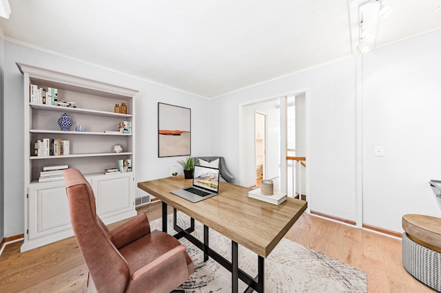 5945 Kellogg Ave, Edina, MN 55424 - home office with light wood-style flooring, ornamental molding, and baseboards